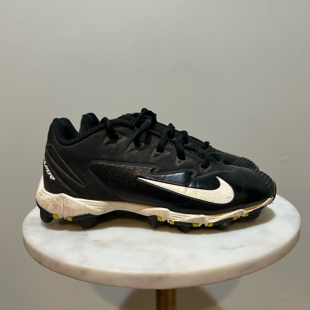 Nike Kids Black Cleats with White Swoosh